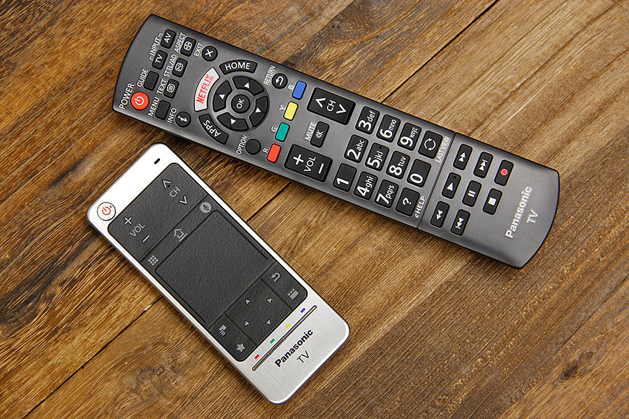 The DX900 comes with a classic remote (Netflix button!) and this smaller remote that does away with the number buttons but includes a touchpad.